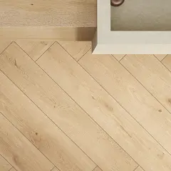 Instalación de porcelanato de 120x20 en espiga, creando un patrón elegante y moderno en el suelo.