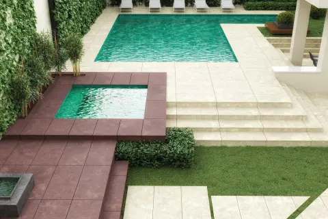 Modern patio with pools and lounge chairs. Ideal para poner suelo exterior sobre cemento, creando un oasis de relajación.