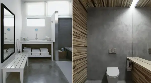Baño con suelo de hormigón pulido, paredes de microcemento y detalles en madera.