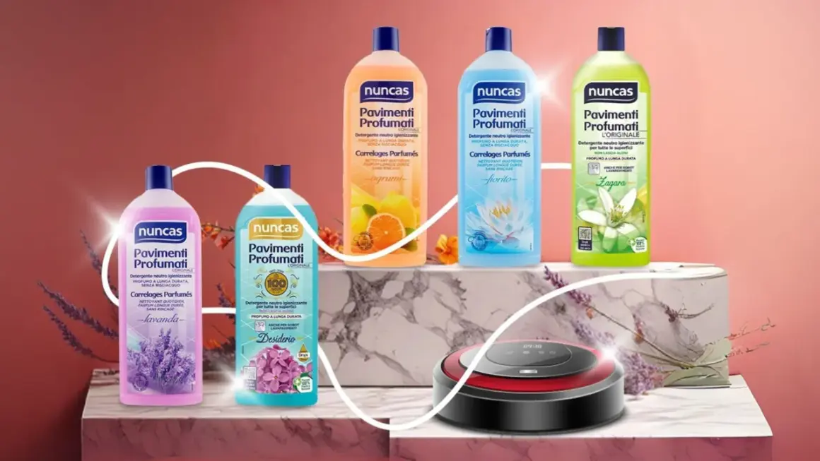 Bot aspirador junto a botellas de limpiador Nuncas para suelos con aromas de lavanda, cítricos, flor de loto y azahar. ¡La legia perfecta para un hogar impecable!