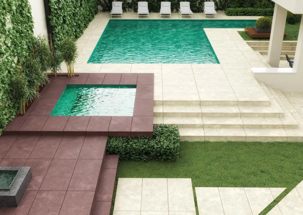 Modern patio with pools and lounge chairs. Ideal para poner suelo exterior sobre cemento, creando un oasis de relajación.