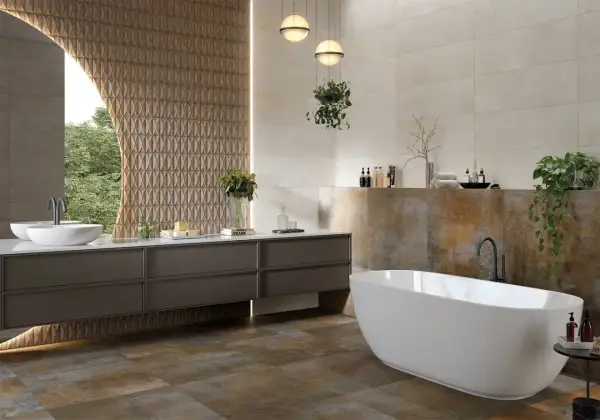 Baño moderno con bañera exenta y lavabo doble. La diferencia entre baldosa y azulejo se aprecia en las paredes, unas lisas y otras con relieve.